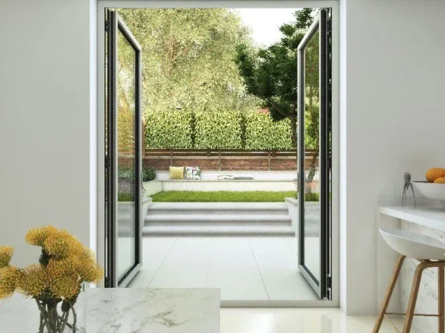 Slim aluminium French doors opening onto a garden