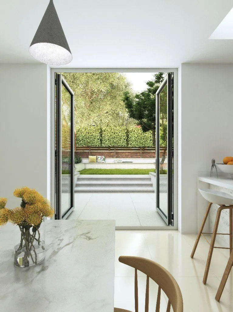 Slim aluminium French doors opening onto a garden