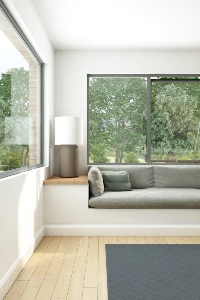 Large aluminium window with a window seat