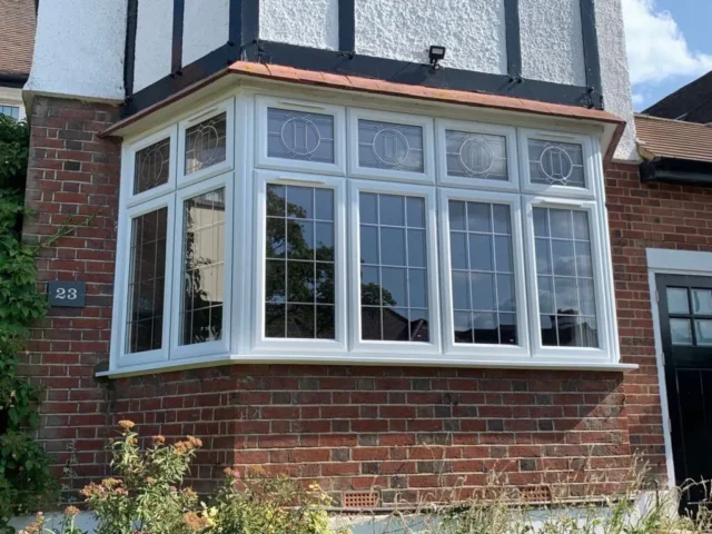 White uPVC bay windows with leaded glass on a 1930s semi