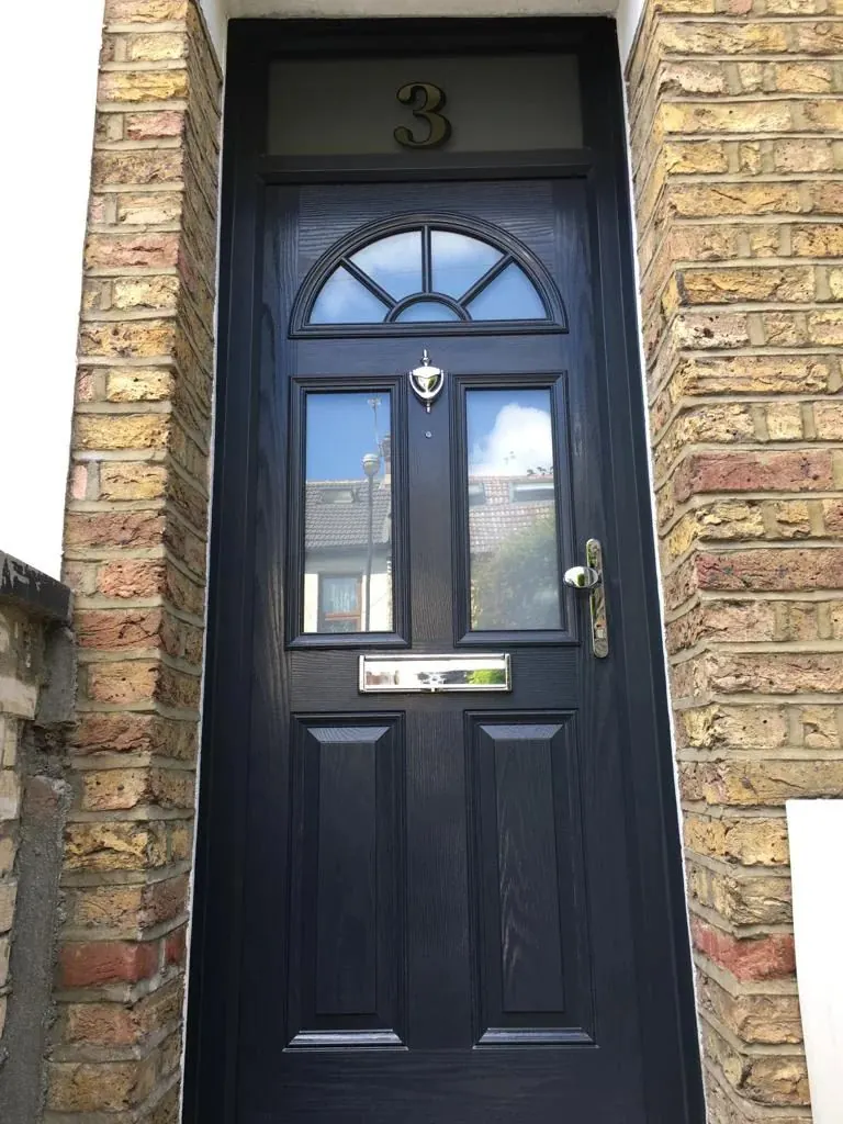Black composite front door with decorative glass