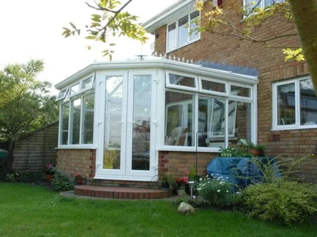 White uPVC conservatory on a brick house