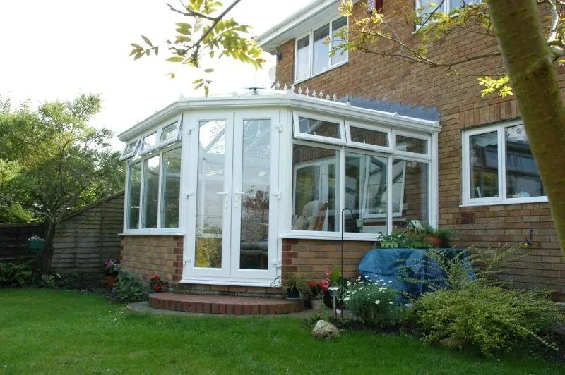 White uPVC conservatory on a brick house
