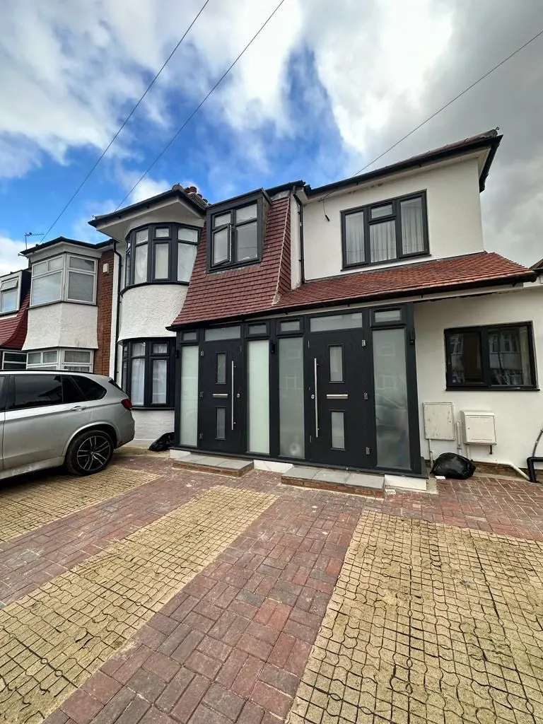 Grey flush casement windows on a detached house