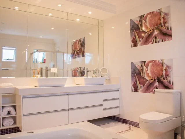 Wall-to-wall mirror above a bathroom vanity