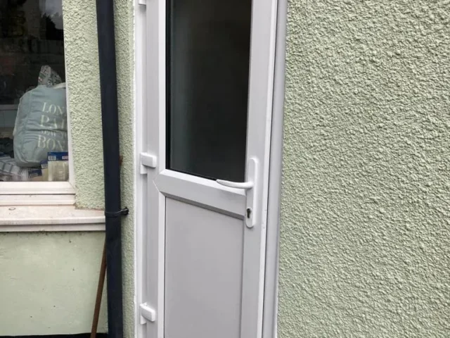White uPVC back door with glazed panel