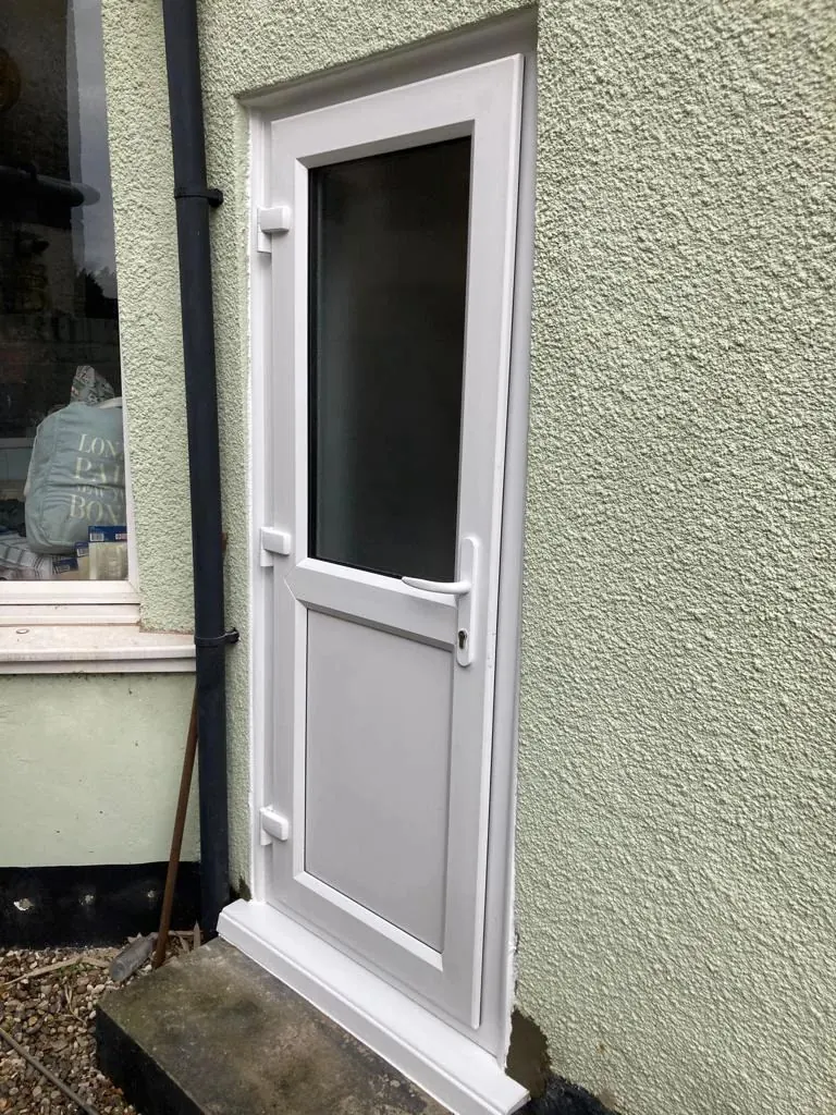 White uPVC back door with glazed panel