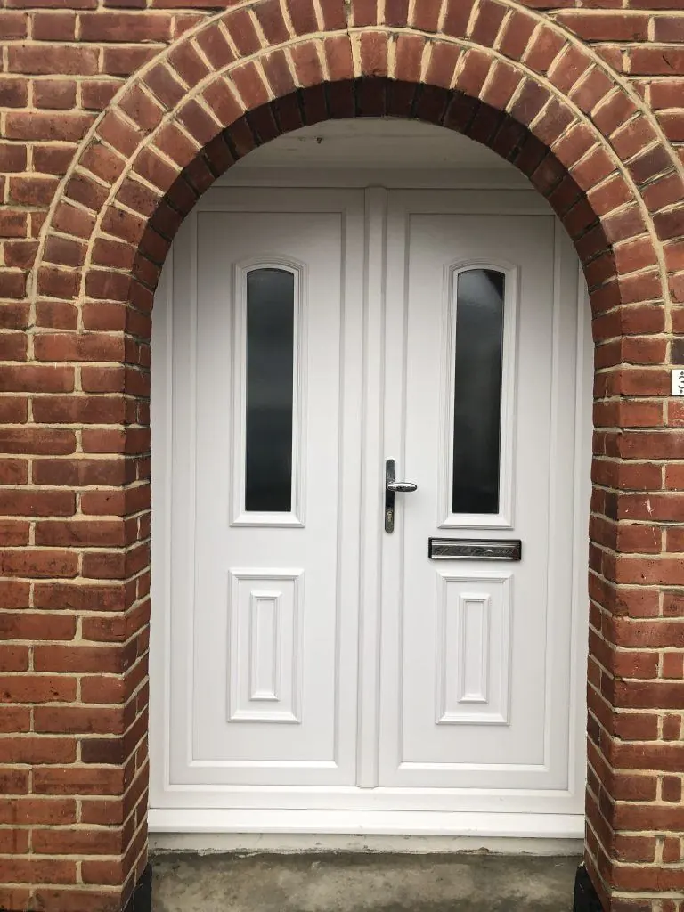 uPVC front door under a brick arch — uPVC doors in Barnsbury